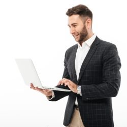 portrait-confident-bearded-man-using-laptop-computer-scaled.jpg